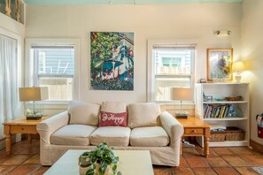 Living room features a sleeper sofa.