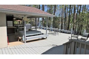 Kitchen steps and ramp access to deck and outdoor living space. Lake view.