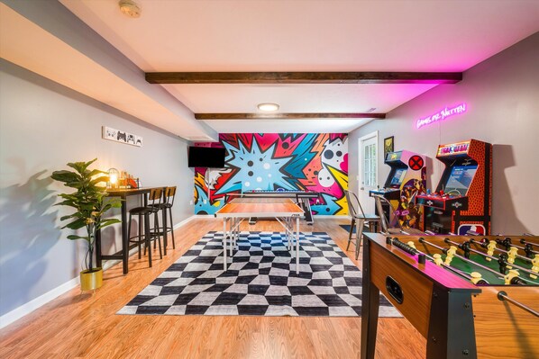 Game room with foosball table, air hockey, 42" TV, arcade games, ping pong table