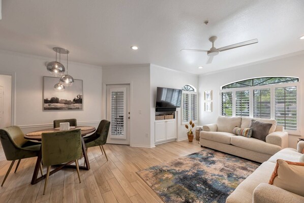 Open living room, table seating and access to the back patio!