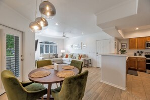 Great floor plan with kitchen, living room, and dining area with seating for 4