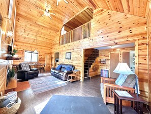 In the main living space you'll notice ceilings as tall pines! Plenty of space for the whole family to stretch out.