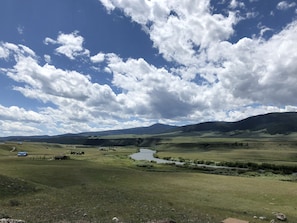 Balcony view of the Madison River Palisades and Gravelly Mountain Range.