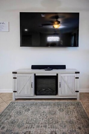 65 in TV with fireplace, downstairs