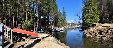 Lakeside at "Marina Beach Cove" Unit 13 Lot 381. Red canoe available for guest use. Paddle to the Marina, just at the end of the cove! There are over 50 steps from the house down to the waters edge. Located 500ft to the popular Marina Beach.