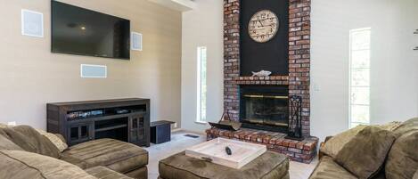 Living room with built-in fireplace. Unit 13 Lot 166, Pine Mountain Lake Vacation Rental, Ridgecrest Rendezvous.