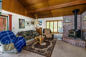 Living room and cozy wood-burning stove. Unit 8 Lot 9, The Hideout, Pine Mountain Lake Vacation Rental.