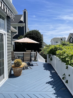 Backyard deck (outdoor shower with hot/cold water and dressing area not seen)