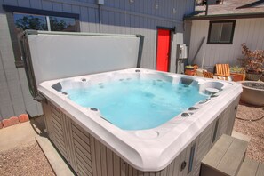 Soak in our new hot tub.  Enjoy even during the day with our motorized awning