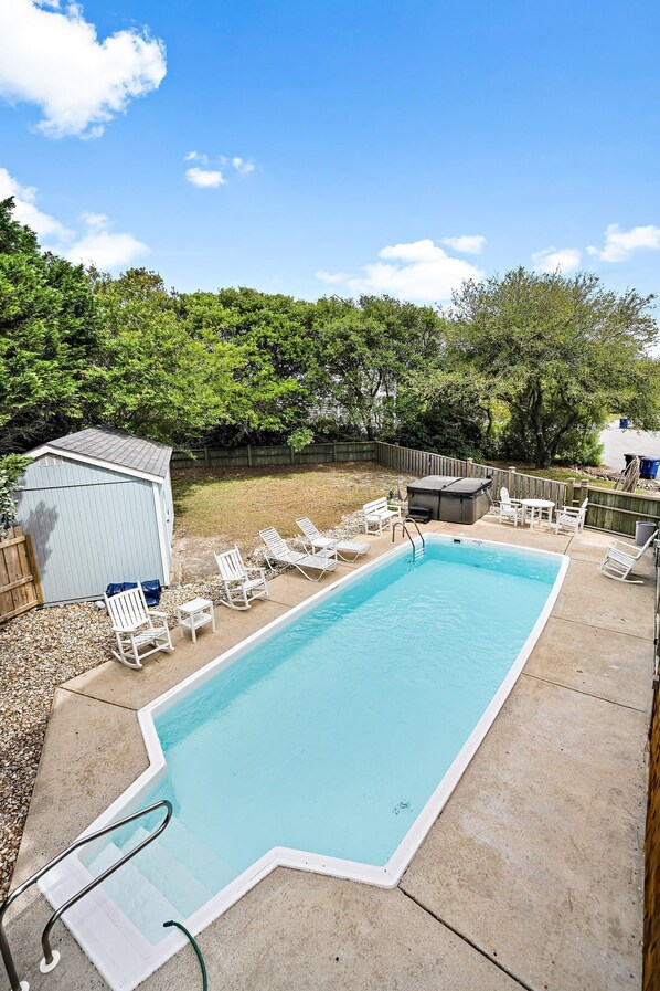 Yard 2 with seasonal heated pool and hot tub separated by a fence and gate to Yard 1