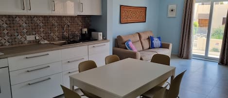 Air-conditioned, well-lit and equipped brand new kitchen, dining and living room