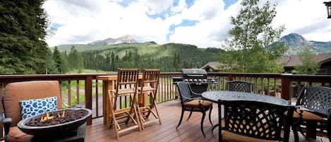 Huge deck off the Main Living space with BBQ Grill, gas firepit and plenty of seating - and views in every direction