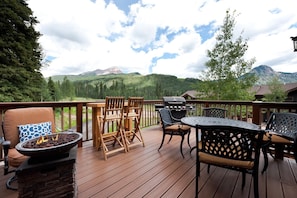 Huge deck off the Main Living space with BBQ Grill, gas firepit and plenty of seating - and views in every direction