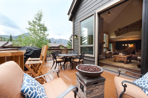Huge deck off the Main Living space with BBQ Grill, gas firepit and plenty of seating - and views in every direction
