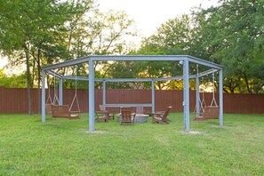 The backyard pergola and fire pit will be an instant favorite! 