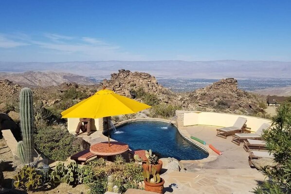 From the top of the courtyard looking down towards the pool area and rear of the property