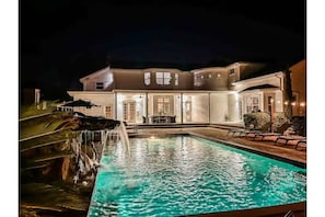 Reset with an oversize pool, electric cover, lounge chairs, fire pit, spa 