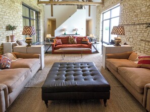 Spacious living area with exposed stone feature walls | The Cotswolds Barn - Crucis, Ampney Crucis, near Cirencester