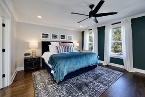 Master bedroom bathed in natural light with elevated neighborhood views