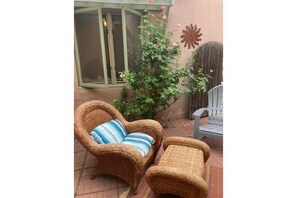 French doors off living room lead to your private gated courtyard.