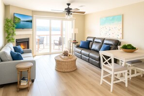 Large open living room with view of the lake fireplace 1 reclining couch sleeper