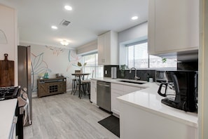 Spacious Kitchen with Bar Area.