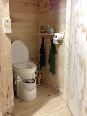 Clean, simple composting toilet is inside the cabin.  