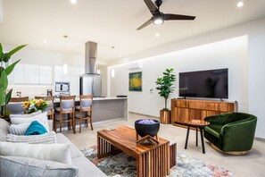 Open plan living, kitchen and dining with 65 Inch TV 