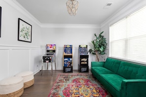 The couch in the game room has a back that lays down for a day bed option!