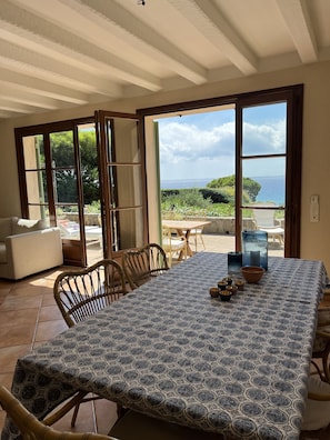 Part of the living room with a dining table.