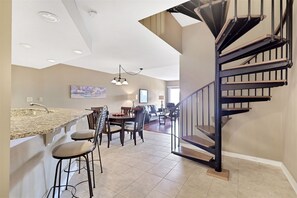 Entry with spiral staircase to bedrooms