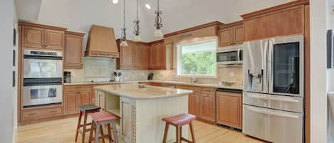 Our Kitchen Features Tall Ceilings, Stainless Appliances and A Large Center Island