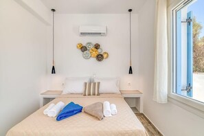 Double Bedroom – Upper Floor (Bedroom 2)
Comfortable double bed, minimal design, access to natural light and balcony.