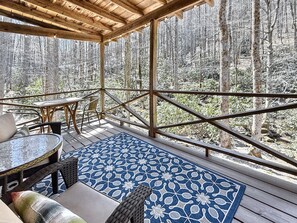 Deck overlooking Shoal Creek. Party lights and comfortable seating