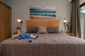 Get a good night sleep in this gorgeously decorated king bedroom with its own custom furniture and luxurious linens.