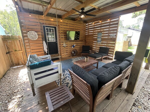 Back patio with 50 inch smart tv. 