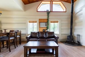The living room, wood burning stove and WiFi. Land line phone and AC unit.
