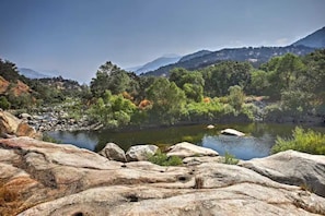 From the rocks above the swimming hole you can look up the river and the canyon.