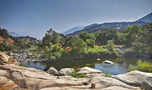 From the rocks above the swimming hole you can look up the river and the canyon.