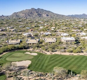 Village surrounded by nearby golf courses.