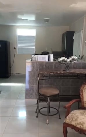 Well equipped kitchen with dining table.