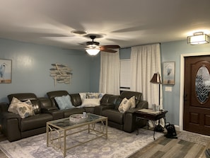 Living room, with electric reclining sofa.