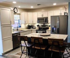 Updated and fully stocked kitchen, seats 4 at Island. Lots of extra amenities.