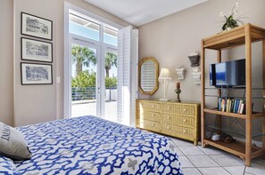 Bedroom 2 features a queen bed and outdoor access.