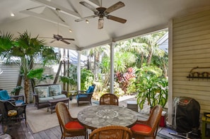 Enjoy meals outside at the covered outdoor dining table.