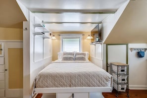 This unit features a queen bed.