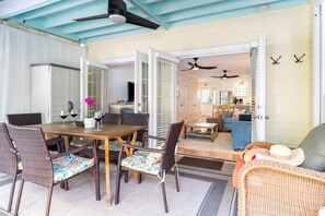 Shaded balcony and large doors make for perfect indoor/outdoor living.