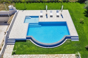 The beautiful swimming pool with solarium and children's area