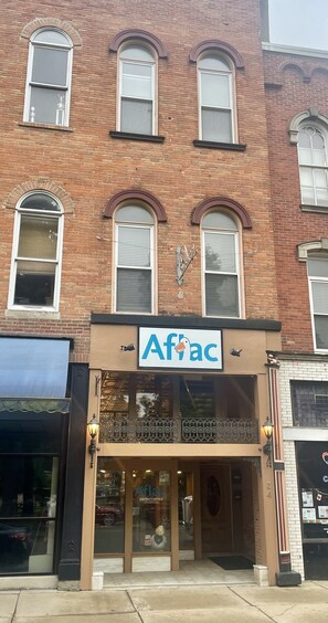 Commercial Aflac on the first floor, apartment on 2nd and 3rd floors.