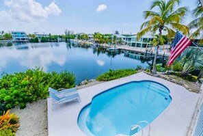 Patio view of pool and bay